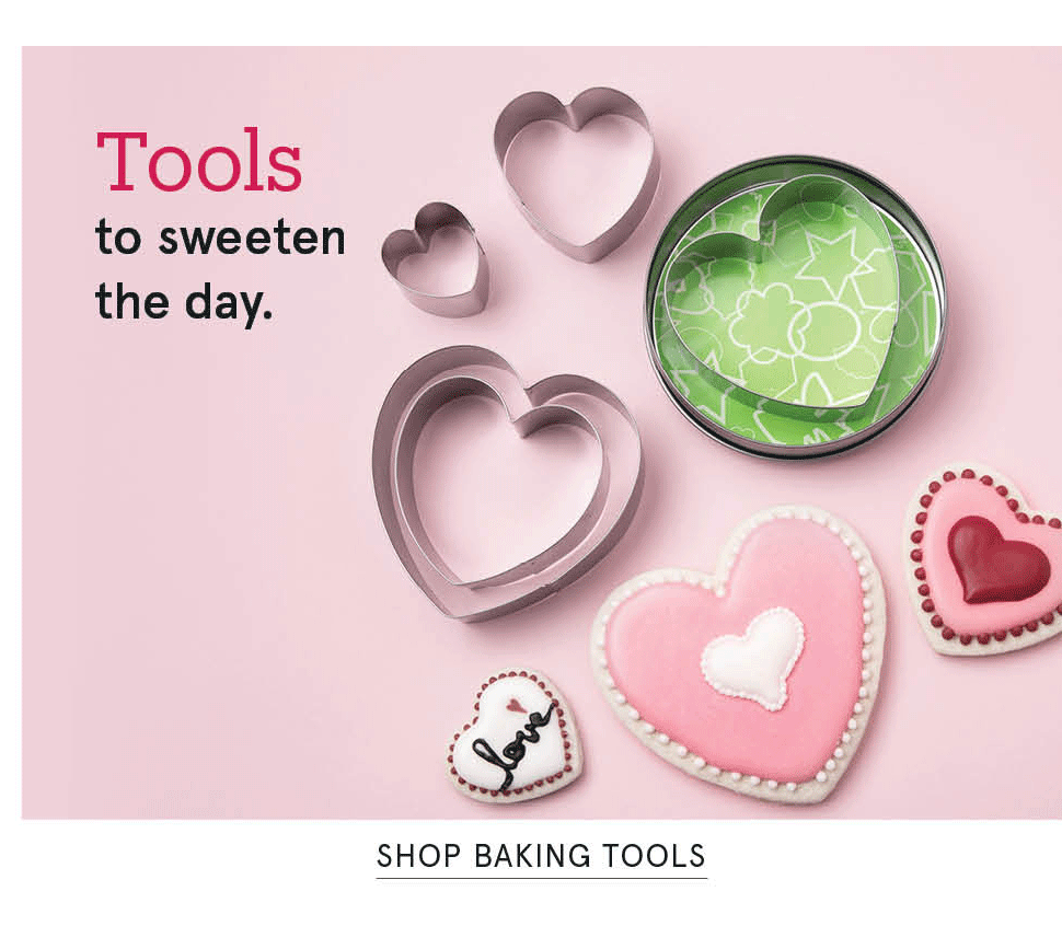 Baking tools you'll love forever! heart-shaped cookies and cookie cutters on a pink background