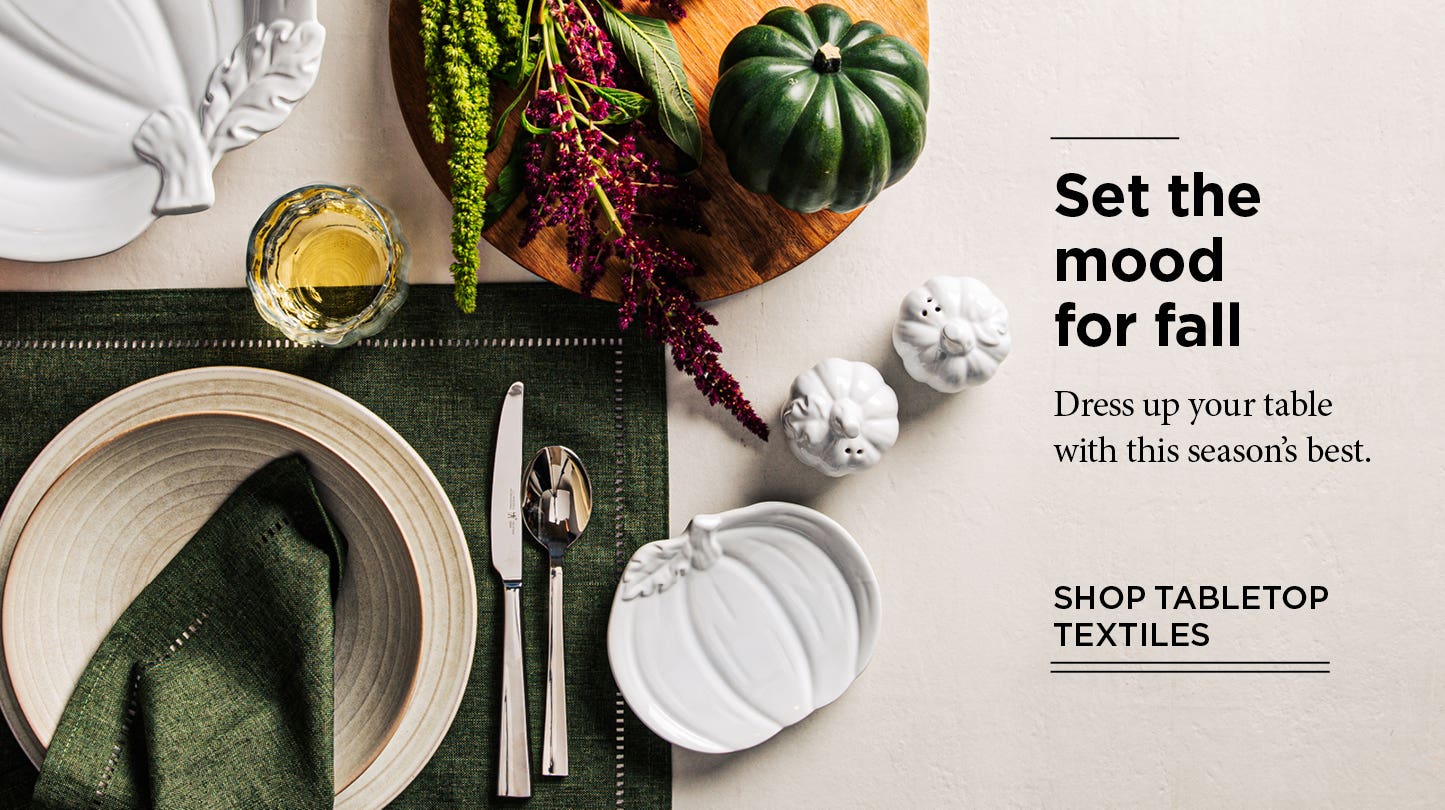 Set the mood for fall - overhead view of placesetting with pumpkin theme dinnerware