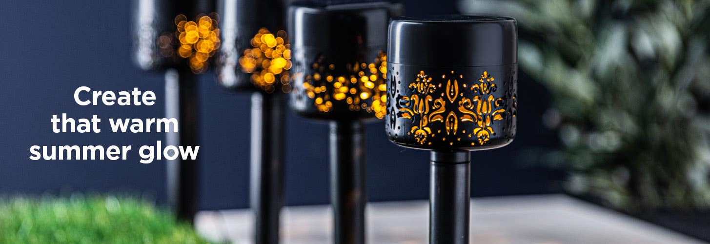 Create that warm summer glow. close-up view of garden stake light