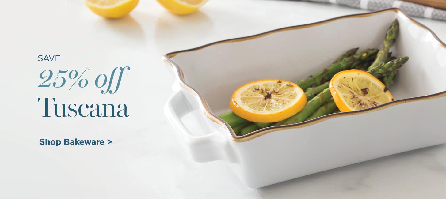 Save 25% off Tuscana - shop Tuscana - close-up of white ceramic bakeware with asparagus and lemons