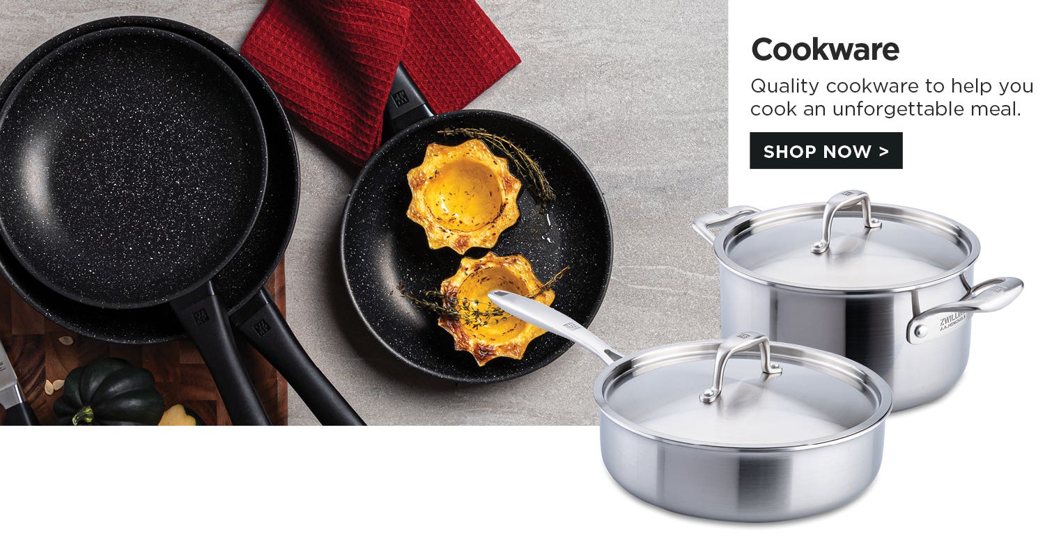 Cookware – Quality cookware to help you cook an unforgettable meal. Non-stick pans on a cutting board and grey countertop